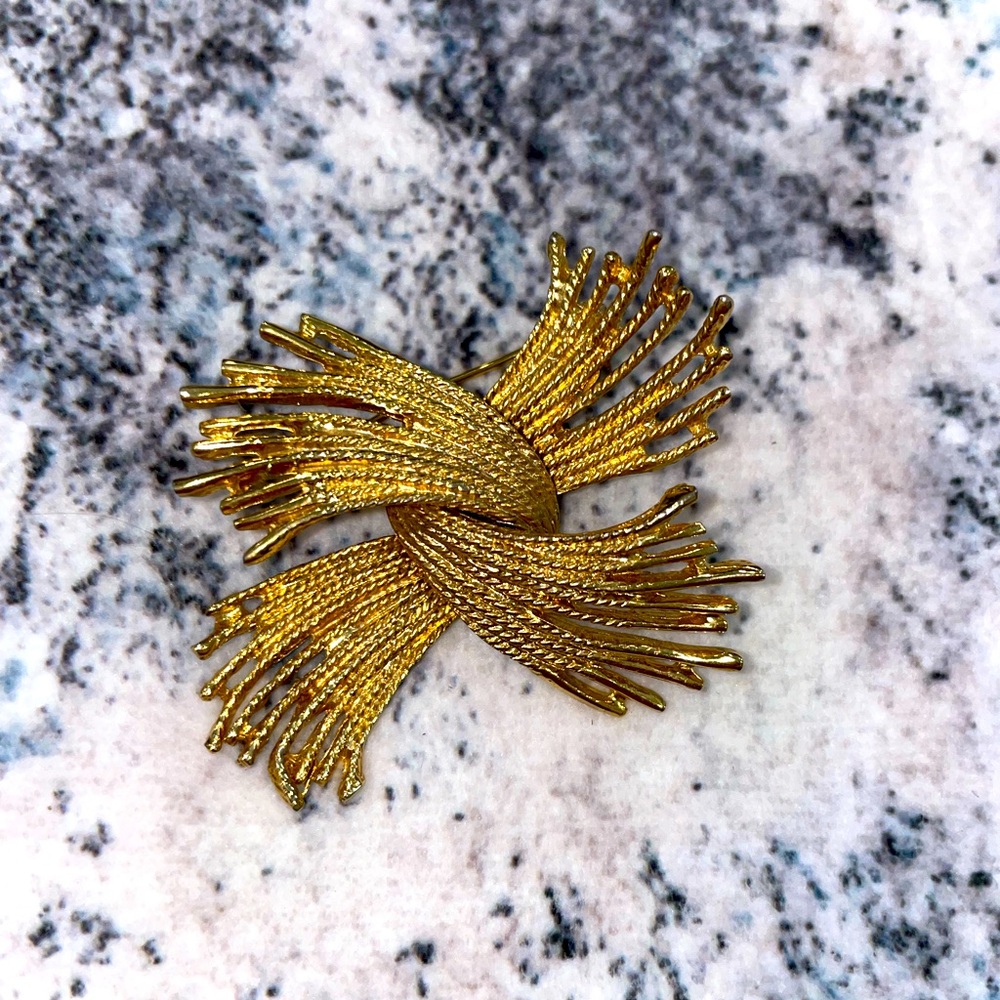 Gold firework brooch